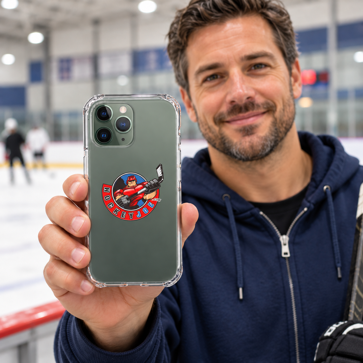 Hockey Joe clear case for iPhone 11 Pro — rink-side lifestyle mockup; phone not included