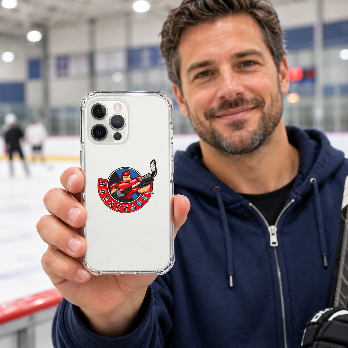 Hockey Joe clear case for iPhone 12 Pro — rink-side lifestyle mockup; phone not included