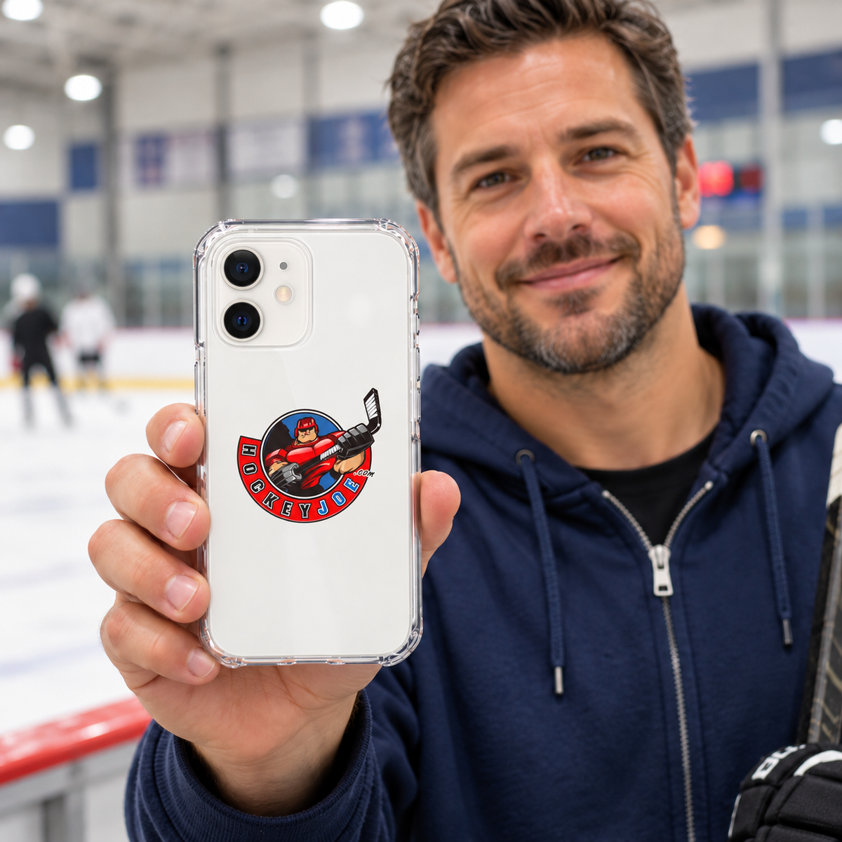 Hockey Joe clear case for iPhone 12 — rink-side lifestyle mockup; phone not included