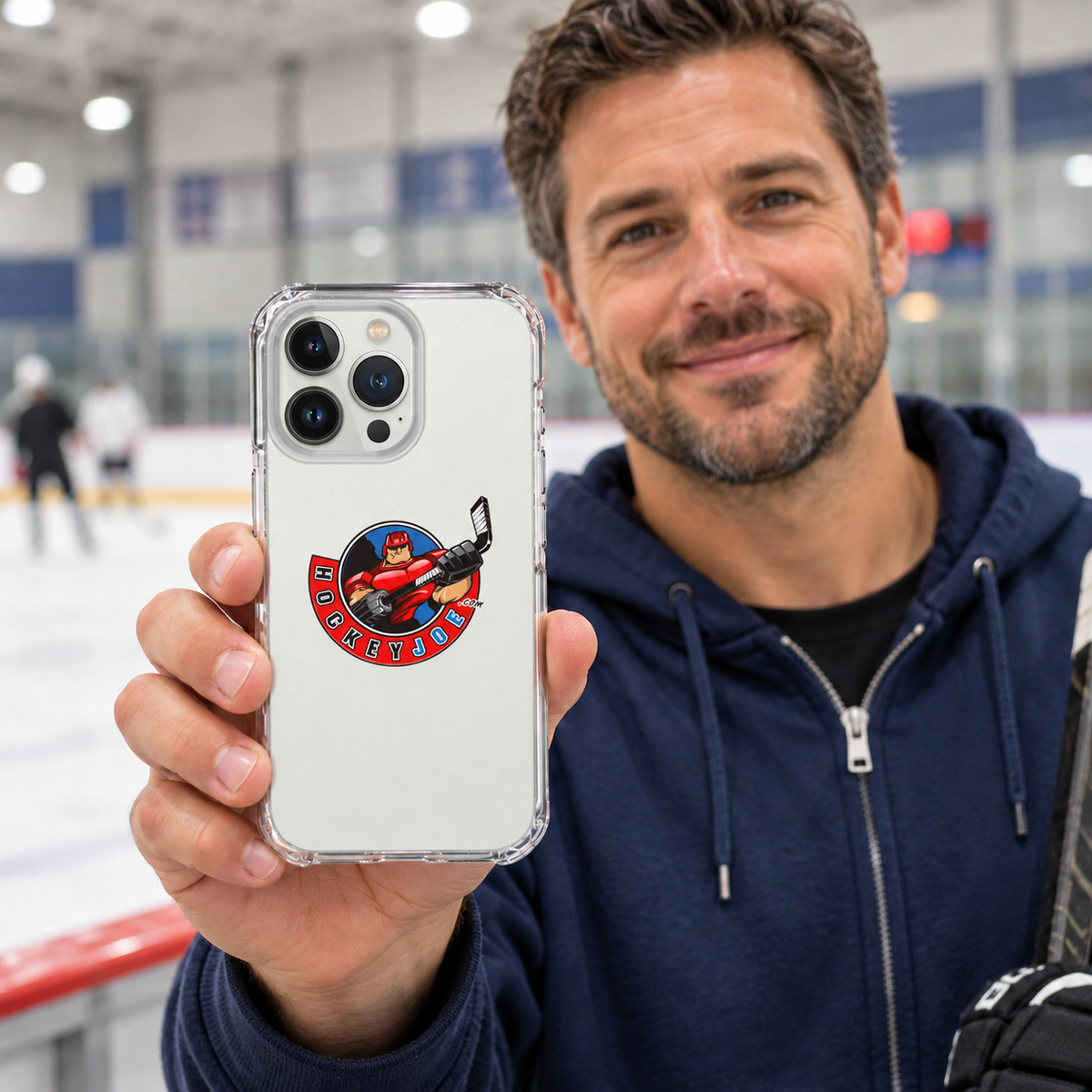 Hockey Joe clear case for iPhone 13 Pro — rink-side lifestyle mockup; phone not included
