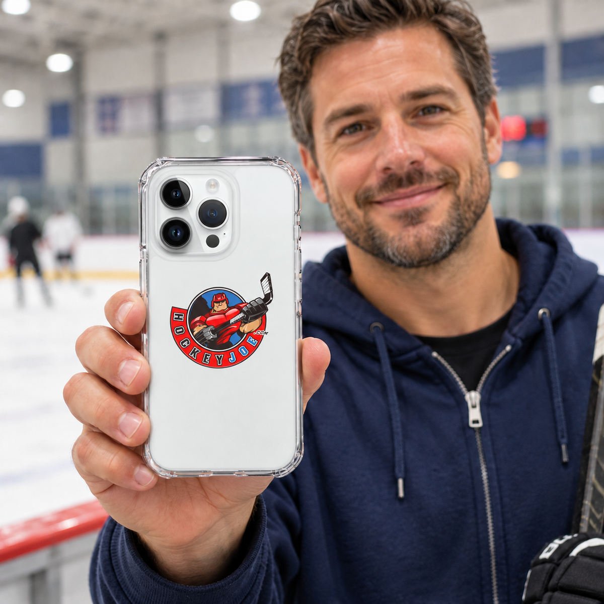 Hockey Joe clear case for iPhone 14 Pro — rink-side lifestyle mockup; phone not included
