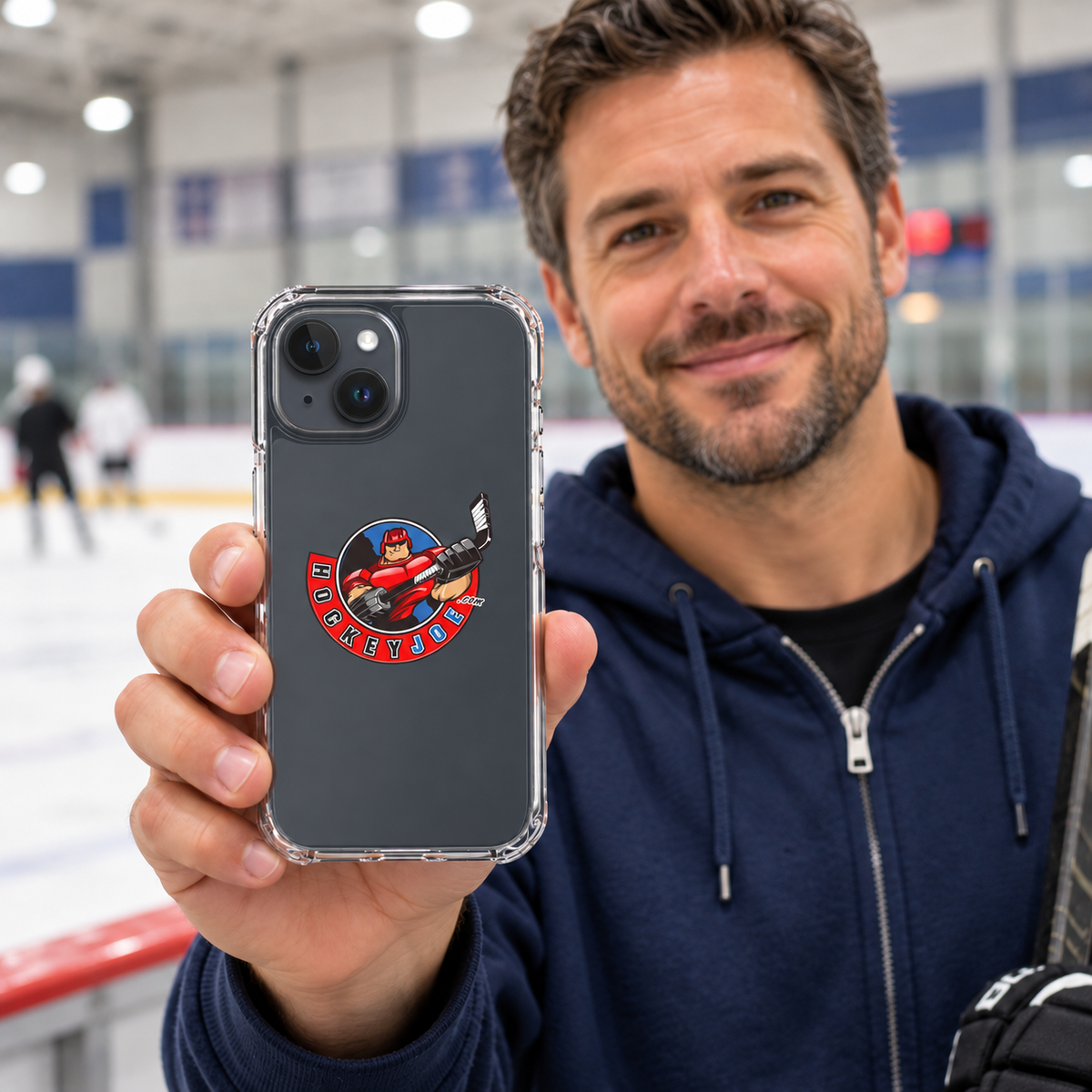 Hockey Joe clear case for iPhone 15 Plus — rink-side lifestyle mockup; phone not included