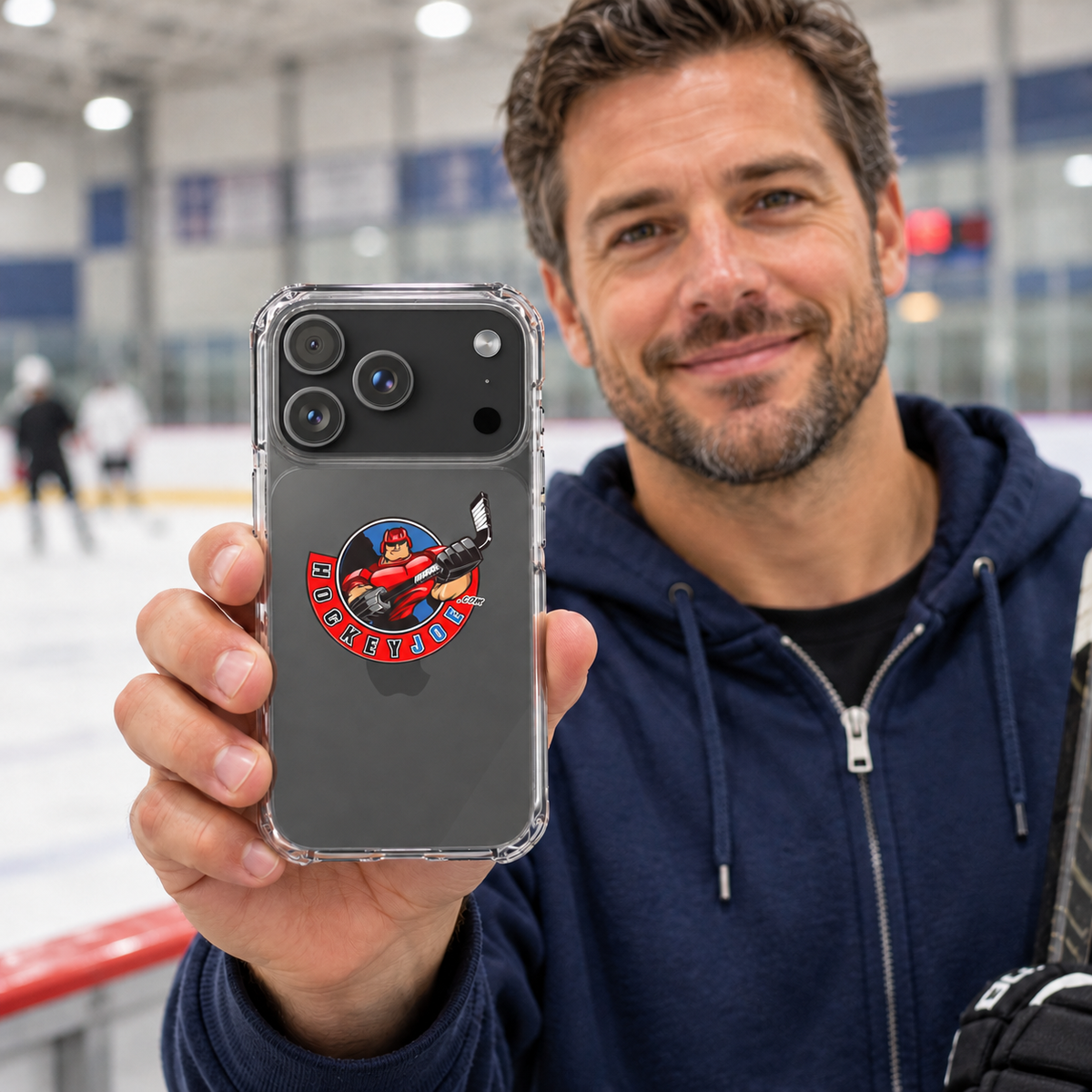Hockey Joe clear case for iPhone 17 Pro — rink-side lifestyle mockup; phone not included