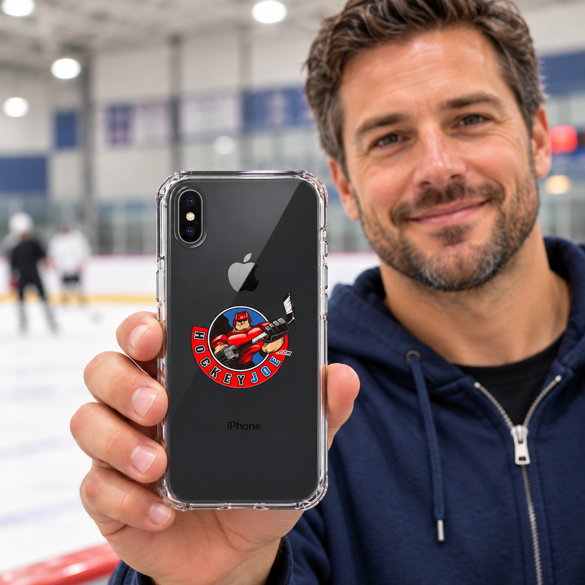 Hockey Joe clear case for iPhone X/XS — rink-side lifestyle mockup; phone not included