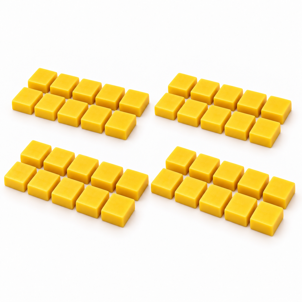 Forty small yellow Hockey Joe tournament giveaway wax blocks arranged in four groups on a white surface