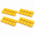 Forty small yellow Hockey Joe tournament giveaway wax blocks arranged in four groups on a white surface